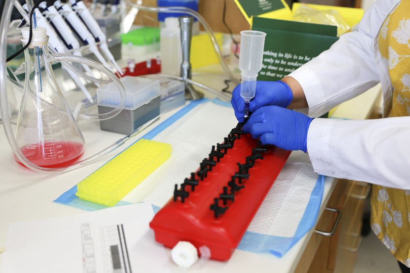 A researcher works in a lab. A researcher works in a lab