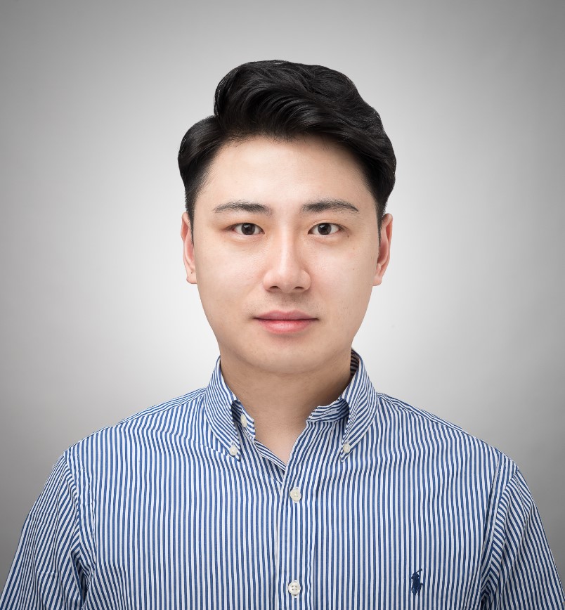 Man with black hair, collared striped shirt