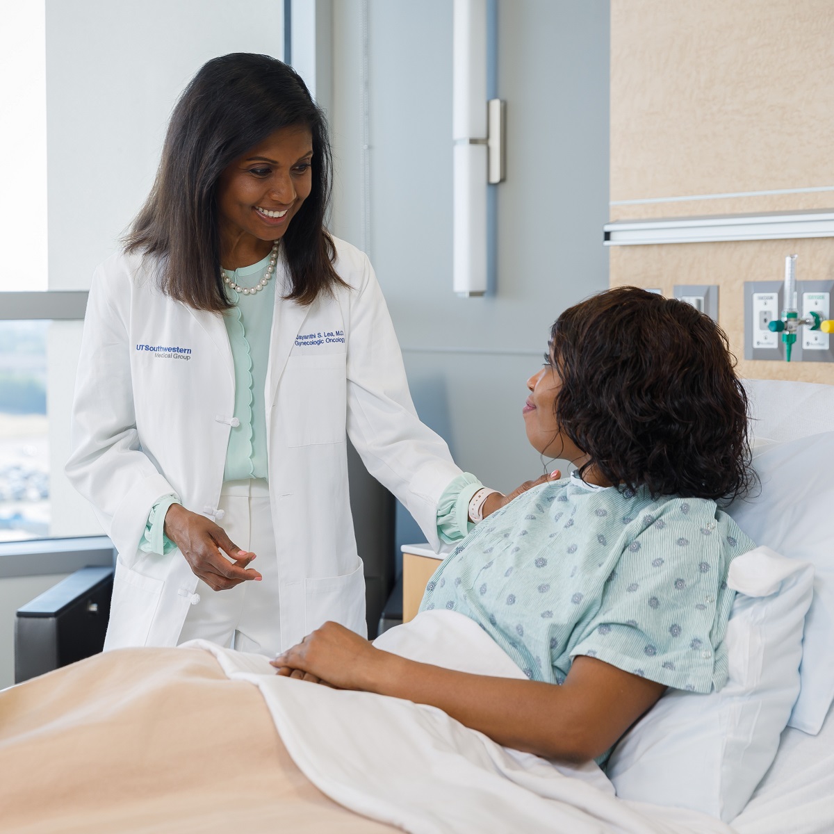 Dr. Lea with a patient at Clements University Hospital Dr. Lea with a patient at CUH