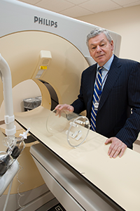 Robert Lenkinski Robert Lenkinski standing by MRI machine