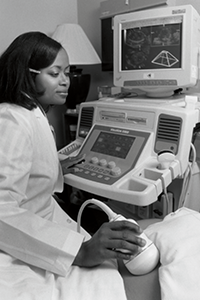 Cecelia Brewington Cecelia Brewington performing a scan on a patient's abdomen