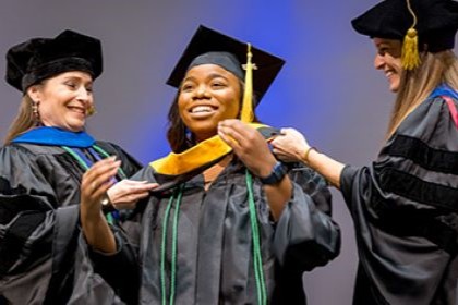 People in graduation gowns