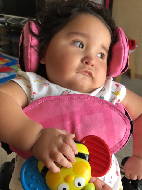 Although Elizabeth Delacruz is blind, her parents offer her stuffed animals and other toys for mental stimulation. Elizabeth Delacruz with a toy
