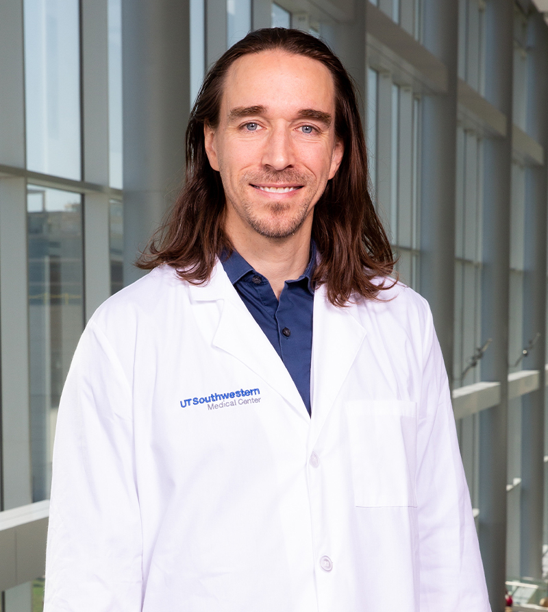 Brad Pfeiffer, Ph.D. A man with brown hair and blue tie