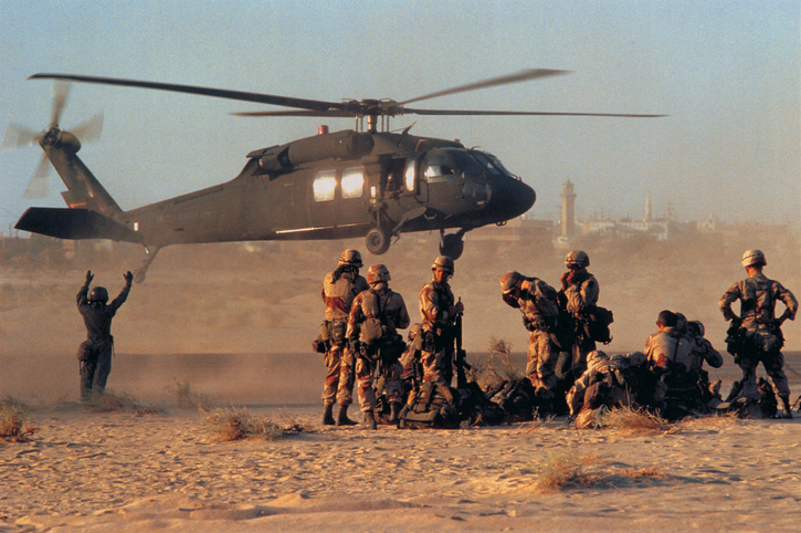 Military troops and helicopter