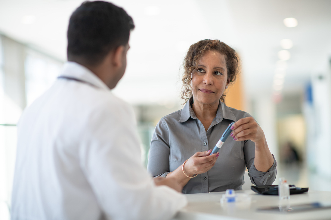 A woman speaking with her doctor
