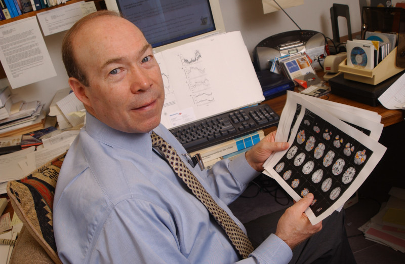 Robert Haley, M.D., here reviewing brain scans