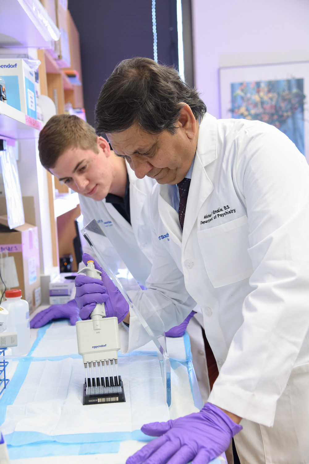 Madhukar Trivedi, M.D. in the lab with a student