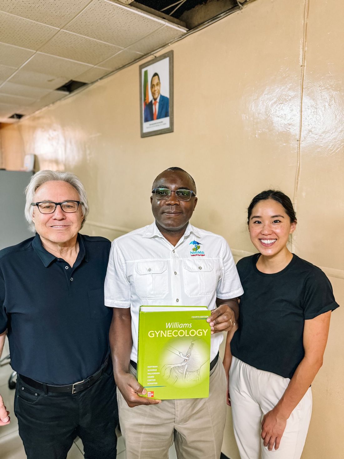 Roger Bedimo, M.D., (center), is Director of UTSW’s Office of Global Health.