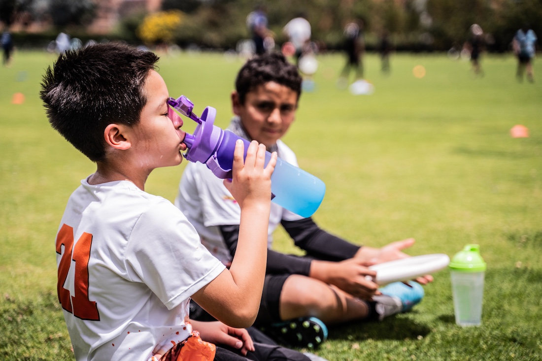 Boy drinking water at the public park