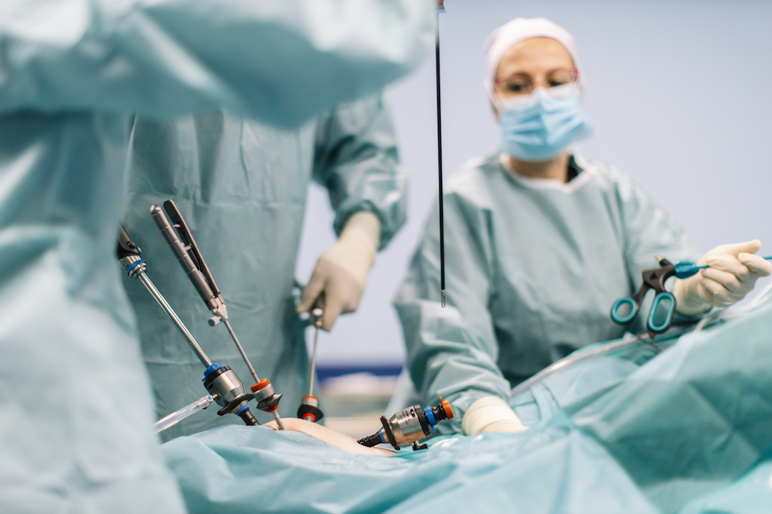 A team of medical professionals performing a laparoscopic surgery at the clinic