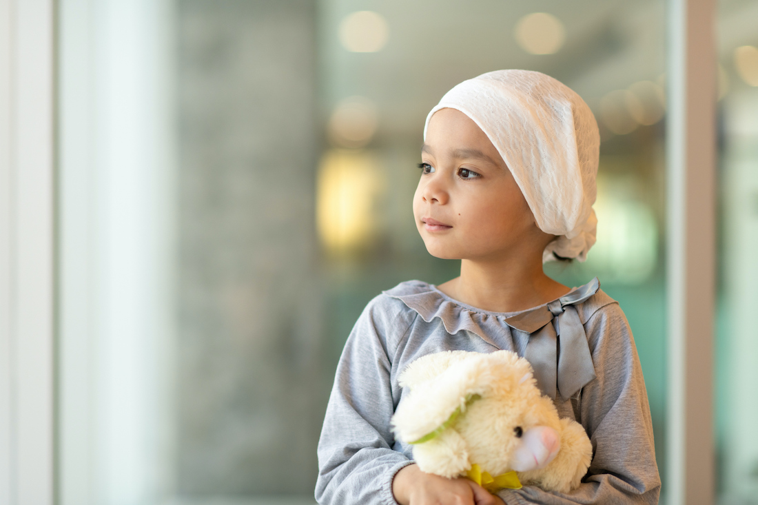A little girl with cancer takes a break from treatment. 