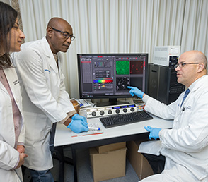 Three medical professionals in the lab, male and female