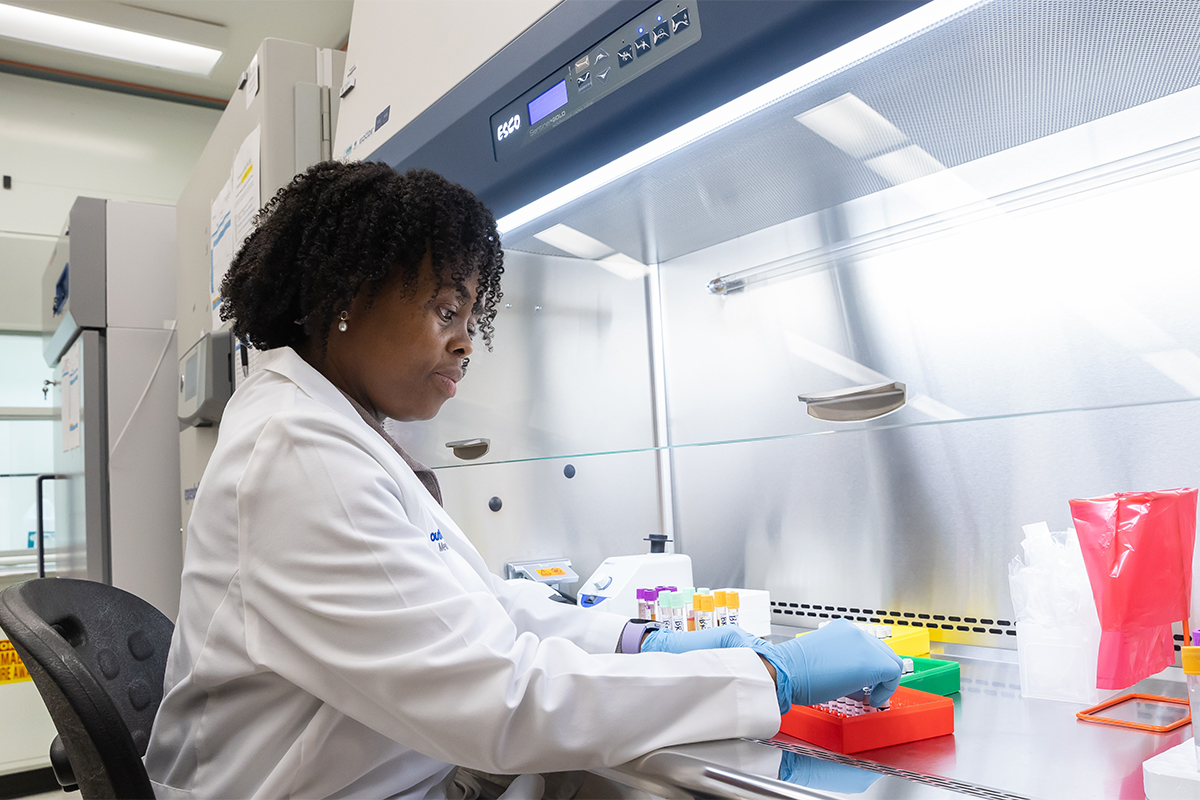 CMRU Lab member working in the Fume Hood