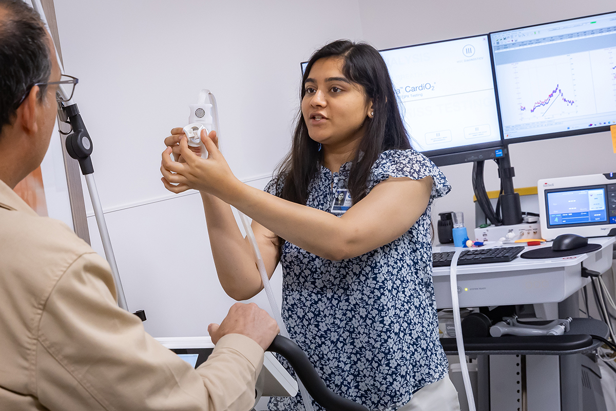 a testing facilitator providing instuction to a test subject