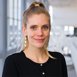 Dr. Kelseanna Hollis-Hansen wearing a black shirt and standing in the Clements University Hospital lobby